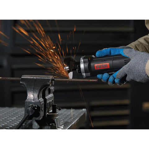 Three Inch Electric Cutoff Tool With Six Amp Motor in use cutting metal pipe, emitting sparks, tool held in gloved hands