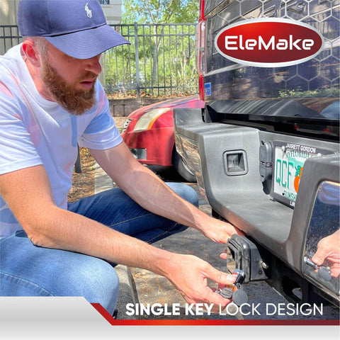 Person installing EleMake trailer hitch lock onto vehicle's tow receiver, demonstrating single key lock design for security.