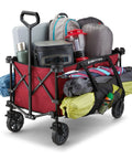 Heavy Duty Collapsible Outdoor Utility Wagon With Oversized 36 By 21 By 15 Bed And 150 Pound Capacity Red Foldable Rolling Cart With Cup Holders And Pockets For Beach Camping Sports Or Picnics fully loaded with outdoor gear
