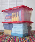 Kickass Clear Plastic Storage Bins Pair 27 Gallon Stackable Totes With Red Snap On Lids And Built In Handles filled with towels and decor
