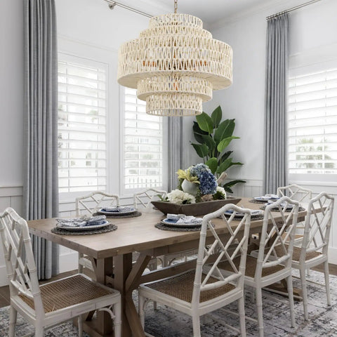Huge White Rattan Chandelier With 6 Lights Hand Woven 5 Tier Pendant Light above dining table in elegant dining room.