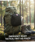 Compact Empty First Aid Pouch For Outdoor Adventures With MOLLE Webbing Black attached to backpack in forest