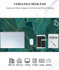 Ultra Large Green Tropical Leaves Desk Pad For Keyboard, Laptop And Computer, XXL Gaming Mouse Pad, Extra Big Full Size Mouse Mat, 35.5 By 15.7 Inches, Desk Setup Game Ready For Work And Gaming, shown with laptop, mouse, and stationery items.