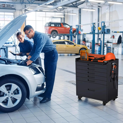 Epic 30 Inch Tool Storage Cabinet with Lockable Rolling Casters and Full Extension Slides for Badass Garage Setup Dope Workshop Gear Chest Heavy Duty Multi Drawer Tool Box Black next to two mechanics working on a car.