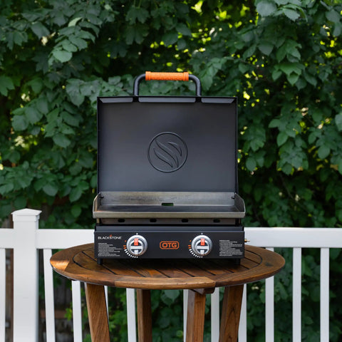 22-Inch Tabletop Griddle With Built-In Hood For Camping And Tailgating on outdoor table