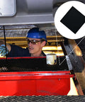 Mechanic using 22 Inch Square No Splatter Oil Change Pad For Cars under vehicle to prevent spills during oil change.
