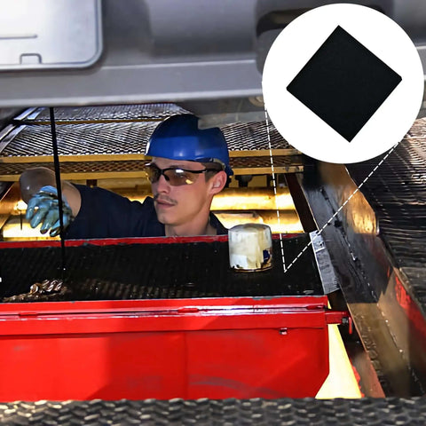 Mechanic using 22 Inch Square No Splatter Oil Change Pad For Cars under vehicle to prevent spills during oil change.