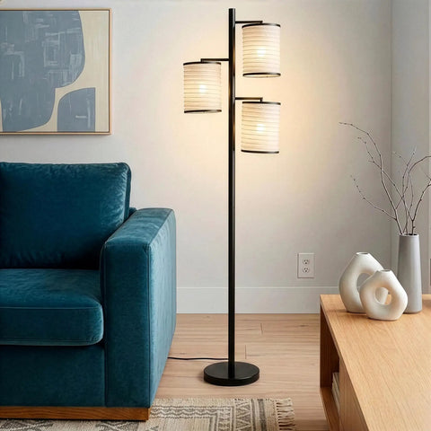 Liam Floor Lamp With Asian Lantern Shade Tree Style Standing Light For Living Rooms Offices And Bedrooms Includes 3 LED Bulbs Dope Ambience Black Finish next to a blue couch and coffee table in a modern living room.