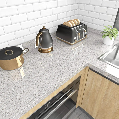 Kitchen countertop with Grey Marble Granite Contact Paper Peel And Stick 36x200 inch roll, showing waterproof surface and modern appliances.