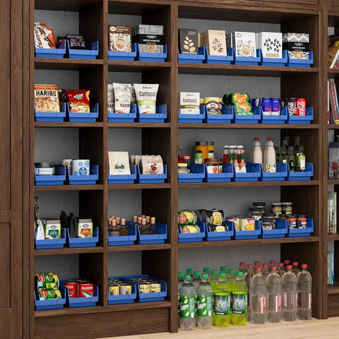 Shelving unit with blue bins organizing snacks and bottles, illustrating use of heavy duty plastic shelf bins for garage, closet.