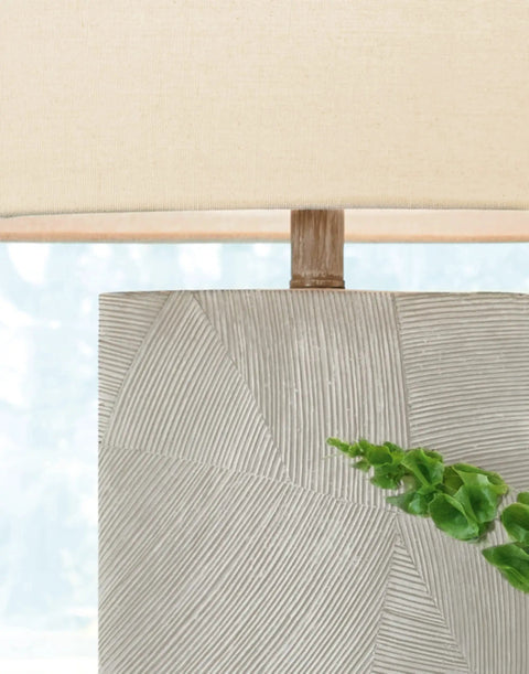 Close-up of 30 Inch Contemporary Ceramic Table Lamp With Dope Brown Ivory Resin Base And Ivory Whitewash Finish and oval off-white shade.