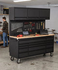 Massive Black Steel Rolling Tool Chest With 14 Deep Drawers And Full Extension Pegboard Back Panel shown in a garage setting.