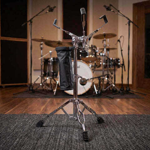 Hardcore Adjustable Snare Drum Tripod Stand With Double Braced Alloy Frame And Drumstick Pouch, close view in studio setup.