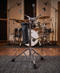 No Nonsense Height Adjustable Snare Drum Stand With Practice Pad Base, double braced alloy tripod, drumstick holder, studio setting.