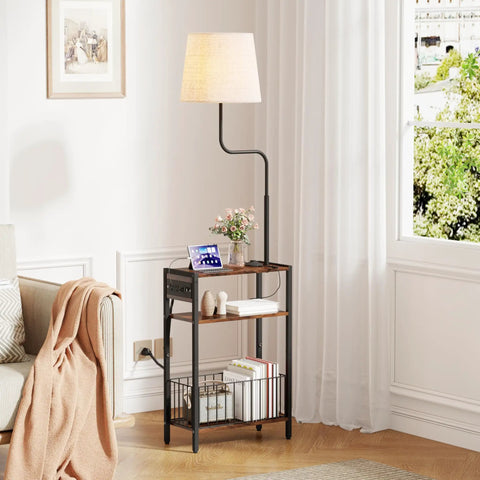 Floor Lamp With Integrated Table And Storage Baskets End Table With Three Color Temperature LED Bulbs Nightstand With USB Charging Station And Shelves Side Table For Living Room Bedroom Or Office Brown placed beside sofa in living room.
