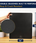 Person holding 14x16 Inch Pizza Steel Pro Grade Heavy Duty Carbon Steel Baking Plate For Oven And Grill showing size and texture.