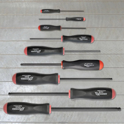 Nine Piece Screwdriver Set With ProGuard Finish, Ergonomic Two Component Handles, Non Slip Grip, Sizes 1.5 to 10 mm on a wooden surface