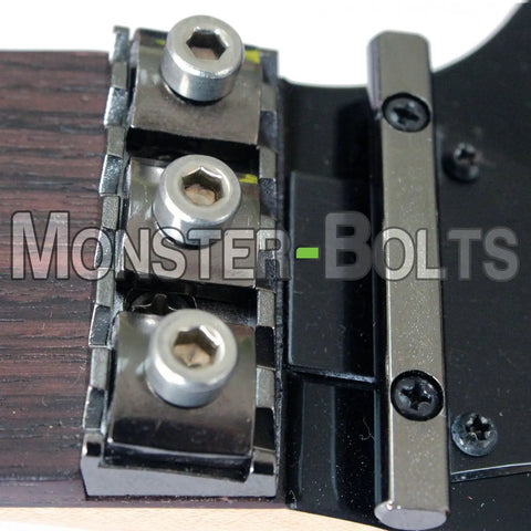 Badass Floyd Rose Style Guitar Locking Nut Screws Set Premium Titanium Fuchsia Finish, close-up of screws for tuning stability.