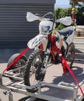 Motorcycle secured with Heavy Duty Cambuckle Straps 1 Inch By 15 Feet 500 Lbs Working Load 1500 Lbs Break Strength Rubber Coated Hooks