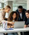Group of professionals using a laptop with Rollerball Pens 0.7 Mm Blue Ink 25 Pack, High Capacity Writing Set on the table