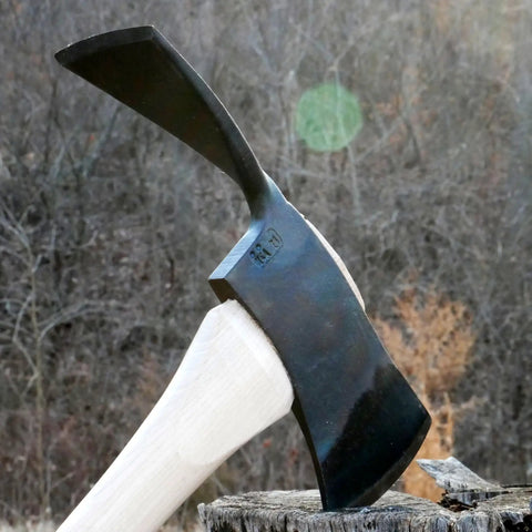 Pulaski Style Wildfire Axe With 3.75 Lb Forged Steel Head And 36 Inch Hickory Handle displayed on a tree stump