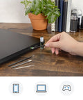 Hand using Phone Laptop Tablet All In One Cleaning Kit With Precision Spudgers Angled Tweezers DeoxIT D100L near a laptop