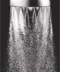 Close-up of full-bodied waterfall spray from chrome handheld shower head with hose and adjustable arm mount for ultra wide coverage.