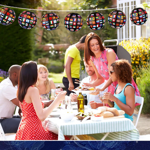 Group enjoying outdoor meal under Flags Of All Nations Paper Hanging Lanterns Set Of 12 For Party Decor Party Ready For Sports Games Birthdays Graduation And International Events Indoor Outdoor Festive Decor.
