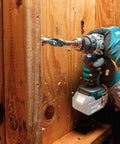 Person using 18V LXT Brushless Cordless Hammer Drill And Impact Driver 2 Piece Combo Kit With 5.0Ah Batteries on wood
