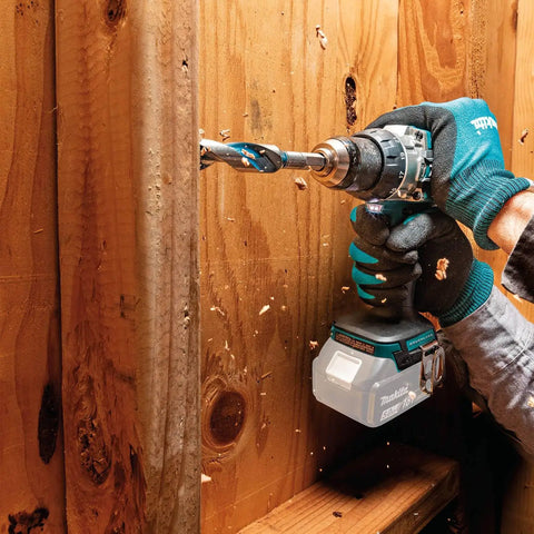 Person using 18V LXT Brushless Cordless Hammer Drill And Impact Driver 2 Piece Combo Kit With 5.0Ah Batteries on wood