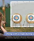 Heavy Duty Archery Backstop Netting 10 X 10 Ft behind targets during backyard practice with a bow and arrows