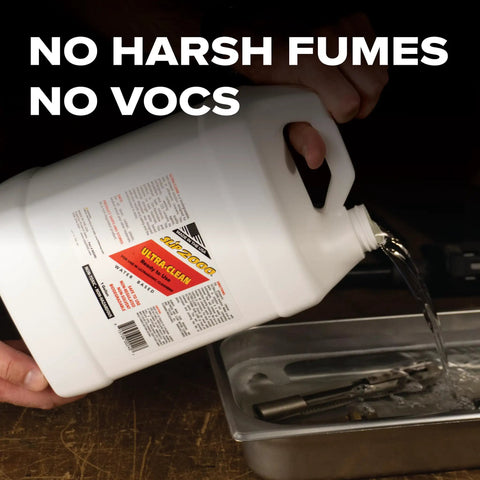 One Gallon Professional Workhorse Ultrasonic Cleaner Fluid Nukes Stubborn Cosmoline Carbon Buildup And Heavy Grease Residue Quickly Wiping Dirtiest Metal Parts Spotless being poured into a cleaning tank.