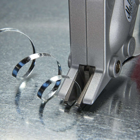 Double Cut TurboShear Attachment for Drills demonstrating clean sheet metal cutting with power assisted 18 gauge capacity.