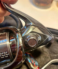 Aluminum Alloy Fishing Reel Cap Replacement For Spinning Reels, Precision Screw Nut Accessory Kit installed on reel.