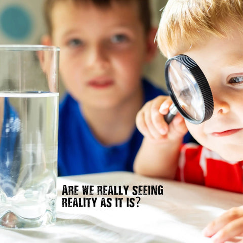 Child examining glass of water with magnifying glass; Optical Illusion Lab Science Kit For Kids Ages 8 And Up With 14 Engaging Experiments And Step By Step Picture Guide An Awesome STEM Educational Toy For Boys And Girls Award Winning Science Kit