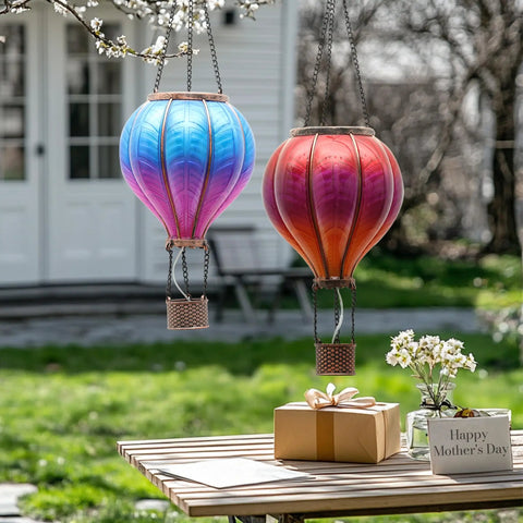 Set Of 2 Dope Hot Air Balloon Solar Lanterns For Outdoor Garden Decor, 18 Inch hanging in backyard, with gift box on table.
