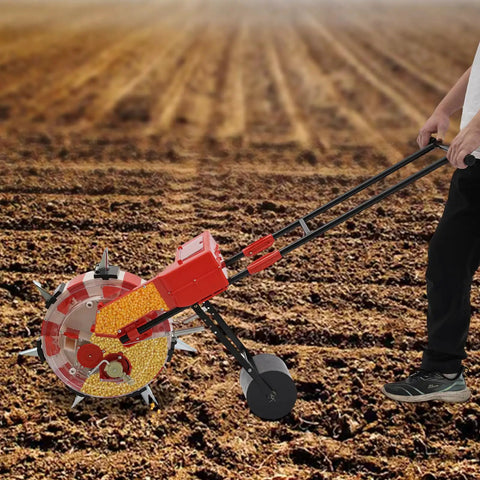 Person using 7 Nozzles Hand Push Roller Seeding Tool With Fertilizer Applicator For Garden Seeding, 9 Inch Planting Spacing