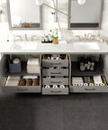 84 Inch Gray Double Sink Bathroom Vanity featuring storage drawers and a white Carrara top, showcasing organized towels and accessories.