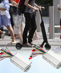 Person riding e-scooter with Beefed Up Dual Mode 12 Tube Brushless Motor Speed Controller for 48V 60V 64V 72V Systems displayed