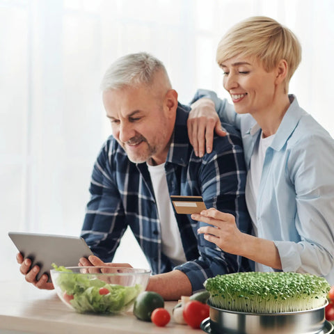 Couple in kitchen with Stainless Steel 4 Tier Seed Sprouting Kit With Lid, 6 Inch Diameter, Indoor Kitchen Garden on counter