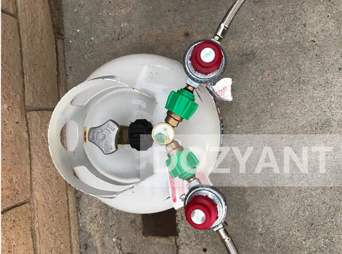 Propane Splitter Adapter With Gauge, 2 Way LP Gas Tee Connector for 20lb Tanks shown connected to propane tank.