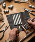15 Pack Low Temp Aluminum Weld Rods 3.1 Inch used for metal repair on wooden table with tools and a heat source