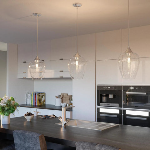 One Light Brushed Nickel Mini Pendant With Clear Seeded Glass Shade sloped ceiling compatible in a modern kitchen