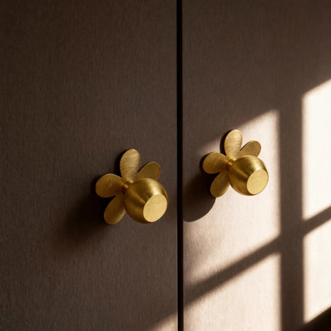 4-Pack Solid Brass Gold Cabinet Knobs With Flower Backplate installed on dark wood surface