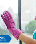 Person cleaning a window with a pack of 50 white 12 by 12 inch cotton terry cleaning cloths for auto detailing and general cleaning.