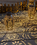 Two Pack Owl Solar Lanterns Outdoor Lights Waterproof Large Antique Bronze Garden Decor projecting patterns on wooden surface