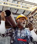 Man wearing Built Tough Cut Resistant Forearm Sleeves Featuring Sweat Wicking HPPE and Reinforced Fiberglass Weave, using a radio.