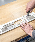 No Fuss Adjustable Door Latch And Strike Plate Router Jig Featuring Knockout Precision and Dual Layer Aluminum Plates on workbench.