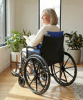 Skil Care Adjustable Wheelchair Lateral Trunk Support With Foam Side Panels For Bilateral Torso Stabilization, user seated in wheelchair.