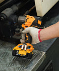 Person using Beast Torque 500 Foot Pounds 20V Cordless Half Inch Brushless Impact Wrench With 4 Speed Settings on machinery